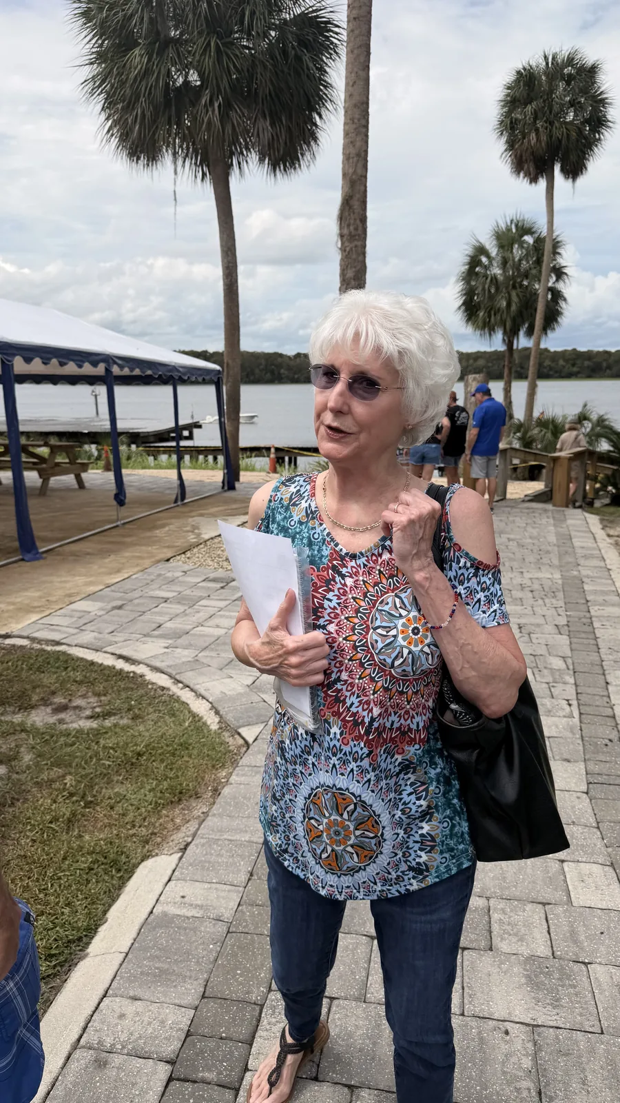 A guest on the riverfront walkway at Cartoberfest in Welaka