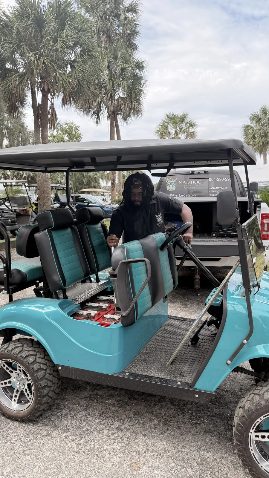 Teal six-seater golf cart at Cartoberfest in Welaka