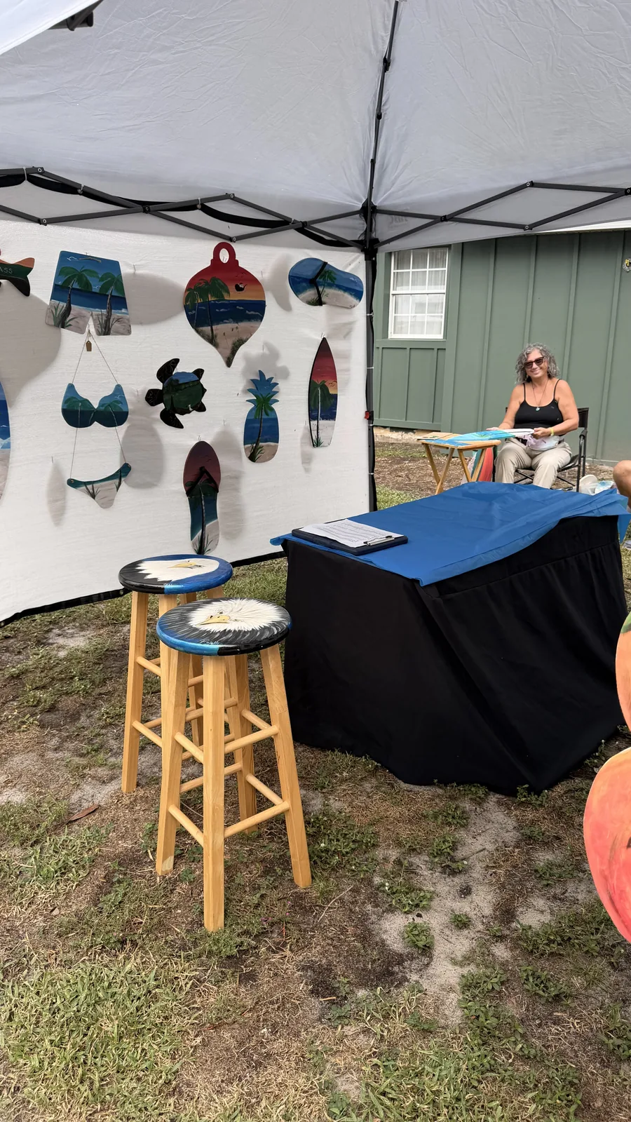 Handmade art for sale at a vendor tent at Cartoberfest in Welaka