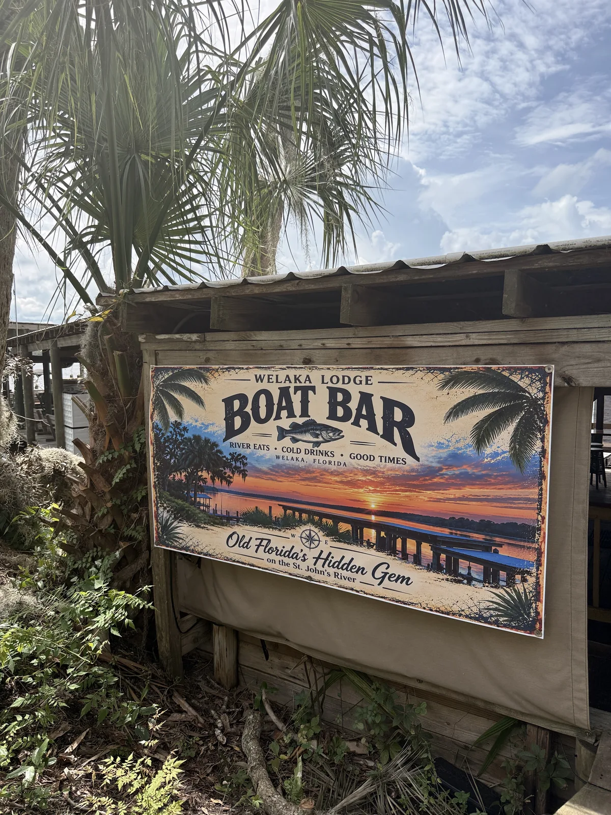 The Welaka Lodge Boat Bar sign at the Cartoberfest venue on the river