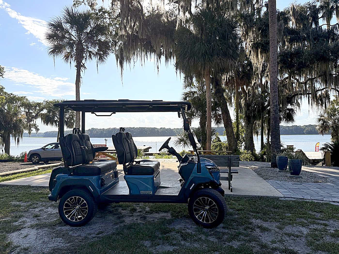 Blue Welaka golf cart at the riverfront