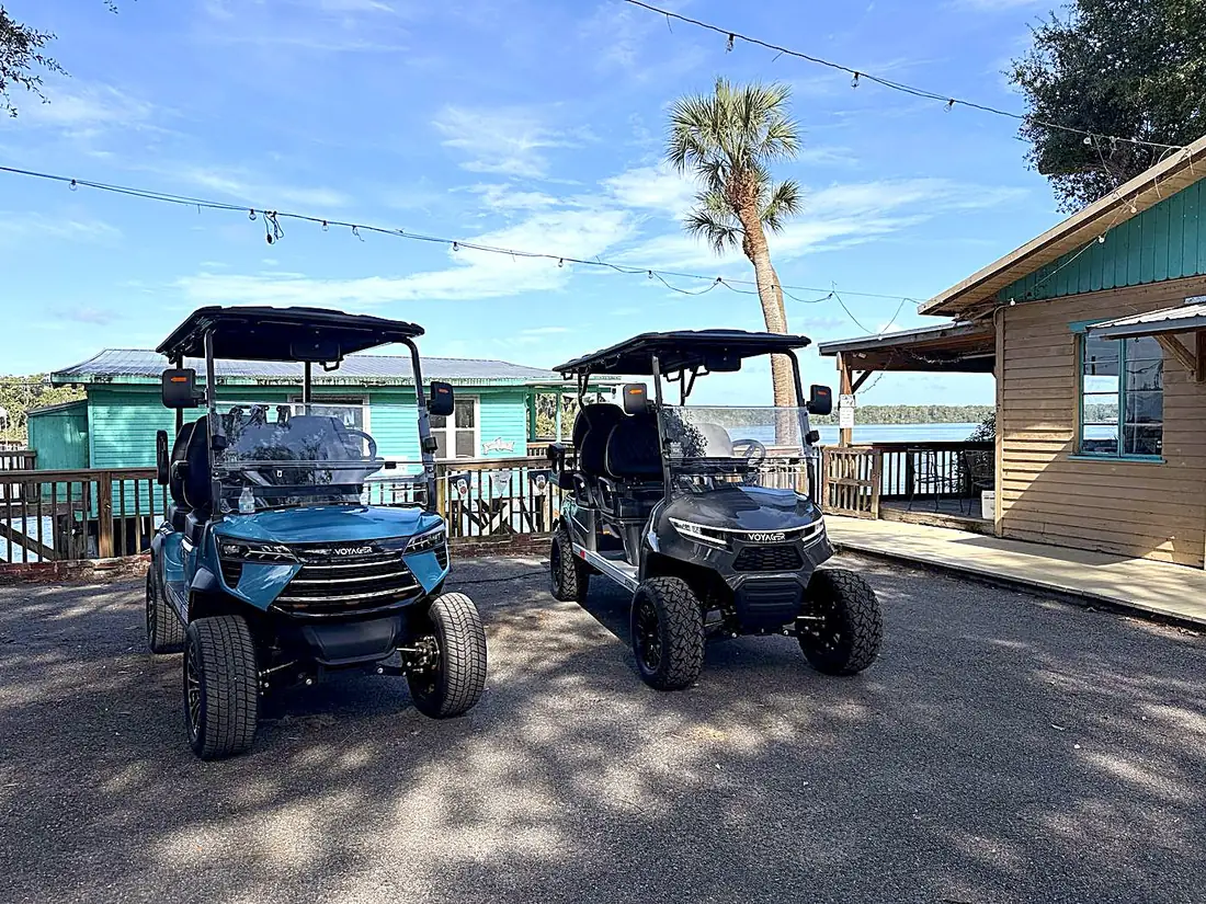 Golf carts by the water at a Welaka marina
