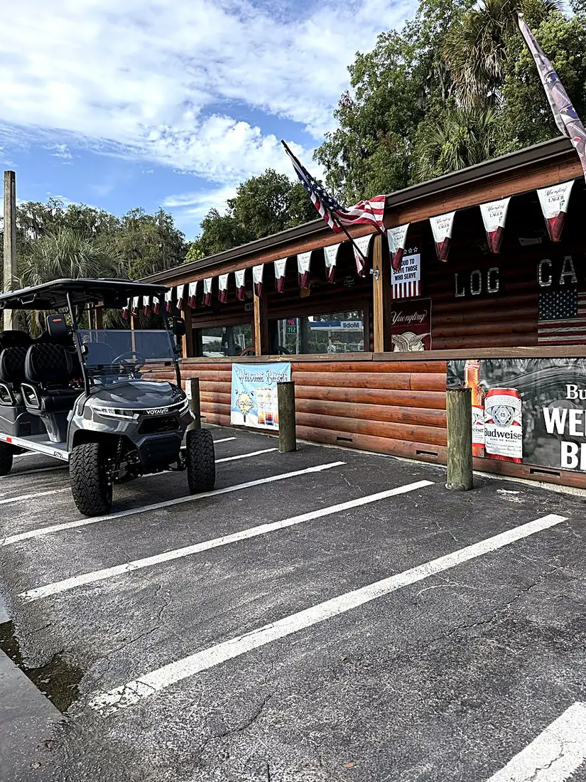 Golf cart parked at Long's Log Cabin in Welaka, Florida