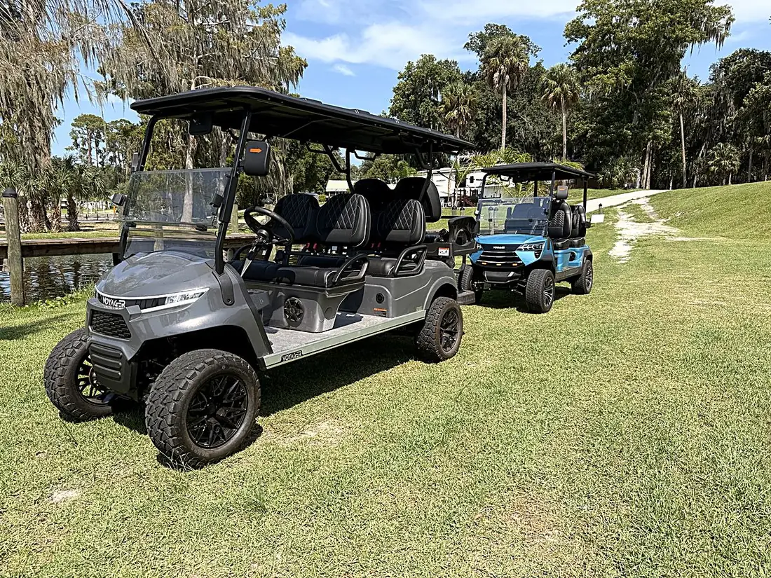 Two street-legal Welaka golf carts on the St. Johns riverfront