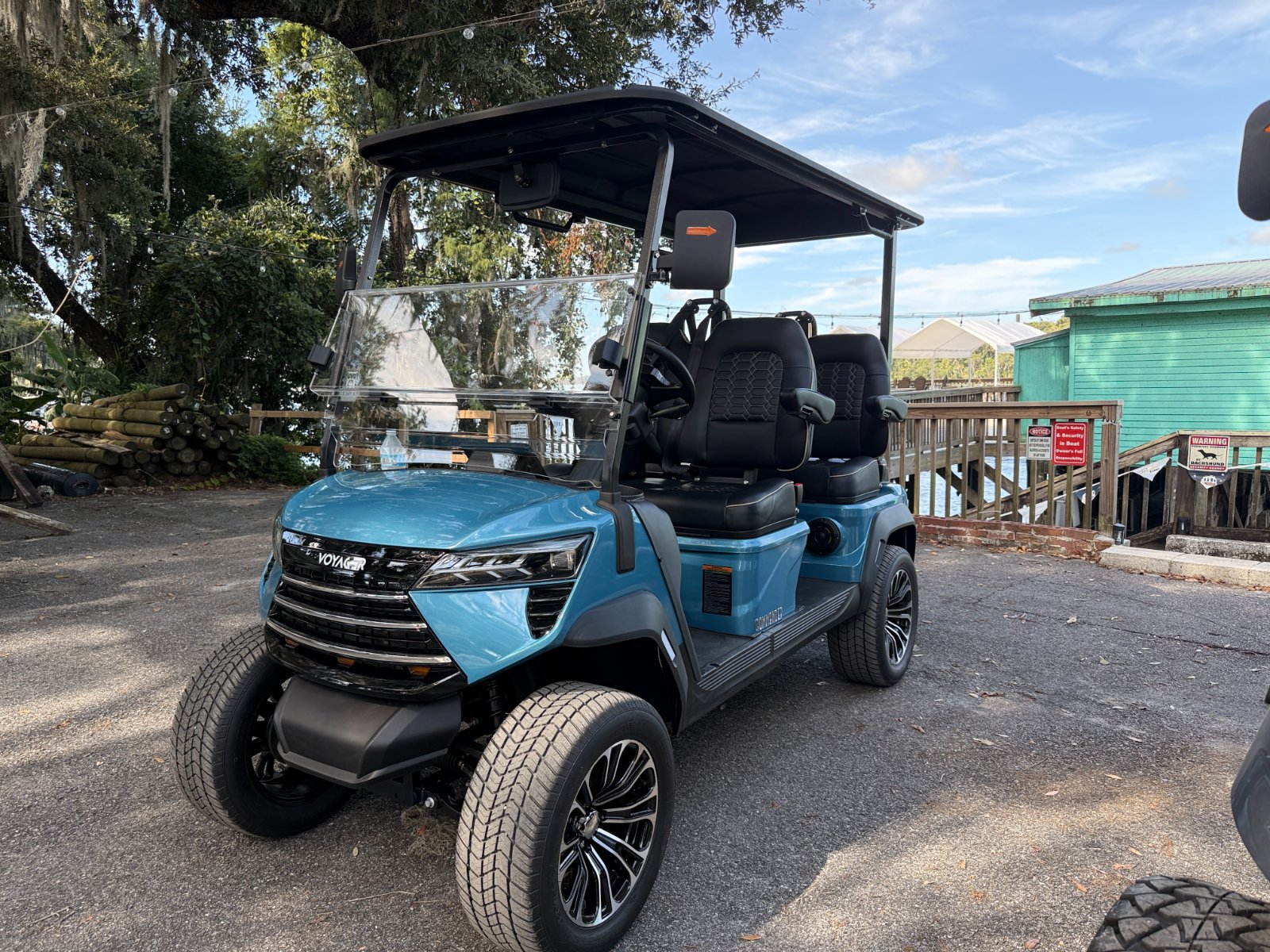 Blue 4-seater street-legal golf cart
